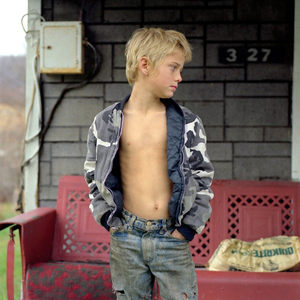 Boy in Front of House